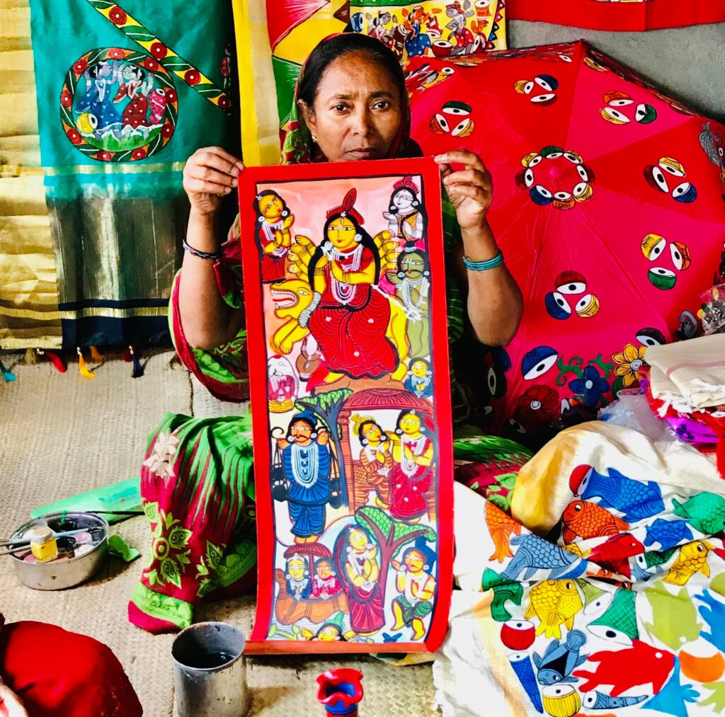An artist of Habi Chak in East Midnapore with painting depicting Hindu tale of Manasa. Photo: Sonia Sarkar